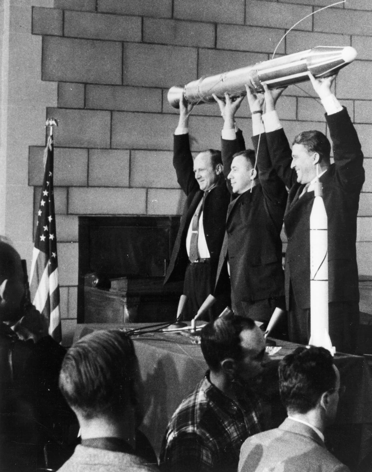 William Pickering, James Van Allen, and Wernher von Braun holding a replica of the Explorer 1 Satellite after its successful launch. © NASA
